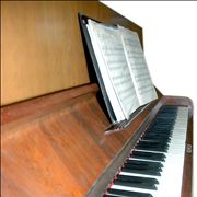 Old Piano with Sheet Music Notes